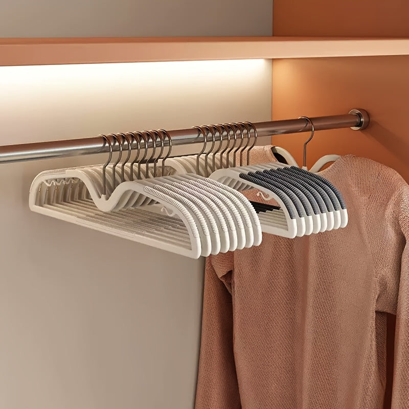 40-pack unisex space-saving hangers with non-slip design & rotating hook for efficient closet organization.