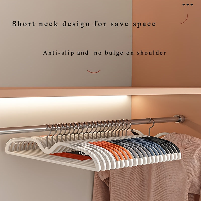 Non-slip plastic space-saving hangers (40 pcs) with rotating hooks for secure wardrobe organization.