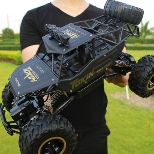 4x4 RC monster truck tackling rough terrain with powerful off-road tires