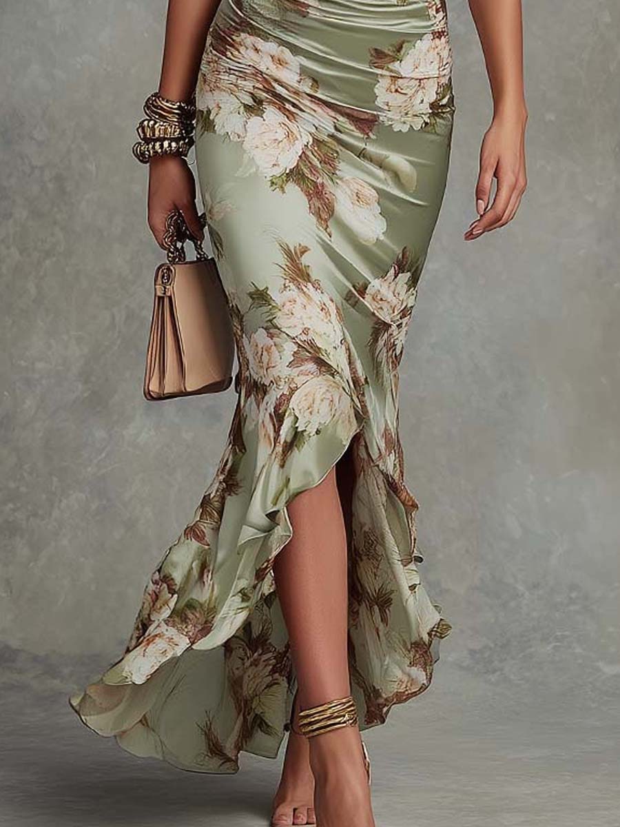 Close-up of the beautiful navy floral pattern on an elegant women's asymmetrical long midi dress, great for parties.