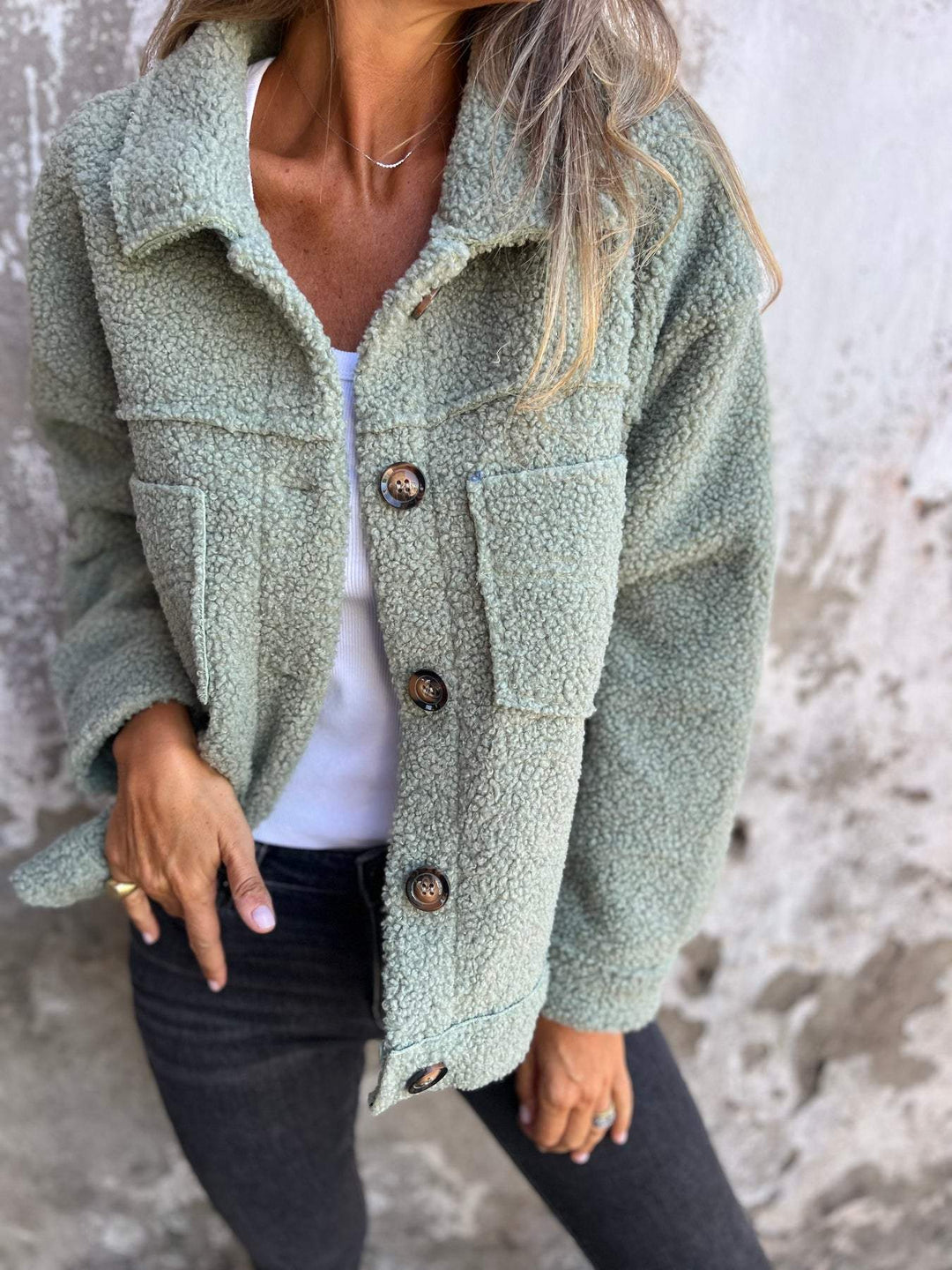 Green women's stylish cozy jacket, hip-length, relaxed fit. Transitional outerwear for everyday comfort in fall/spring.