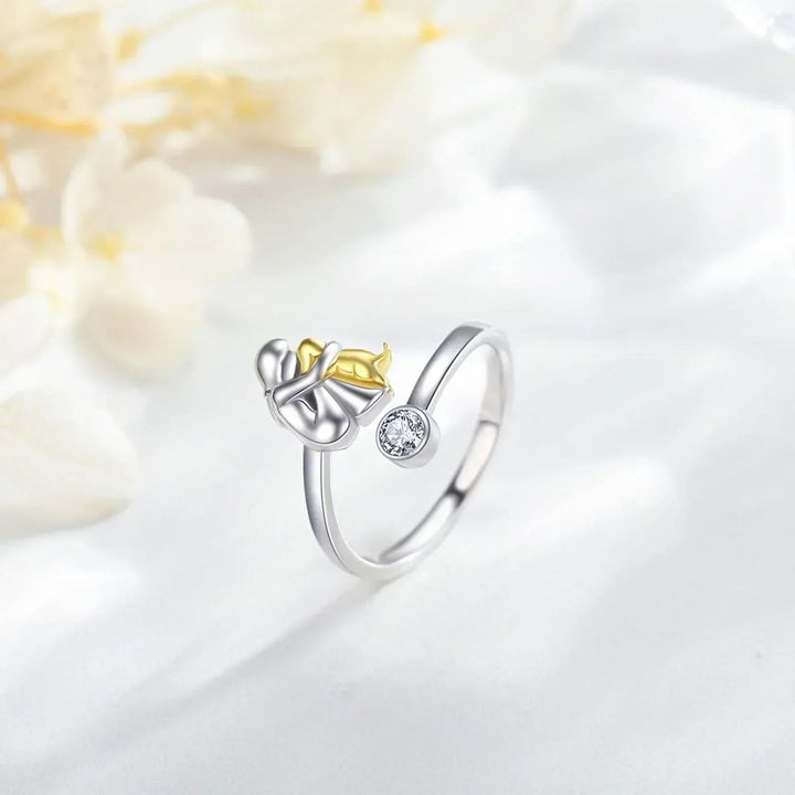 Elegant adjustable silver dog ring with subtle gold accents, hypoallergenic women's animal lover jewelry.