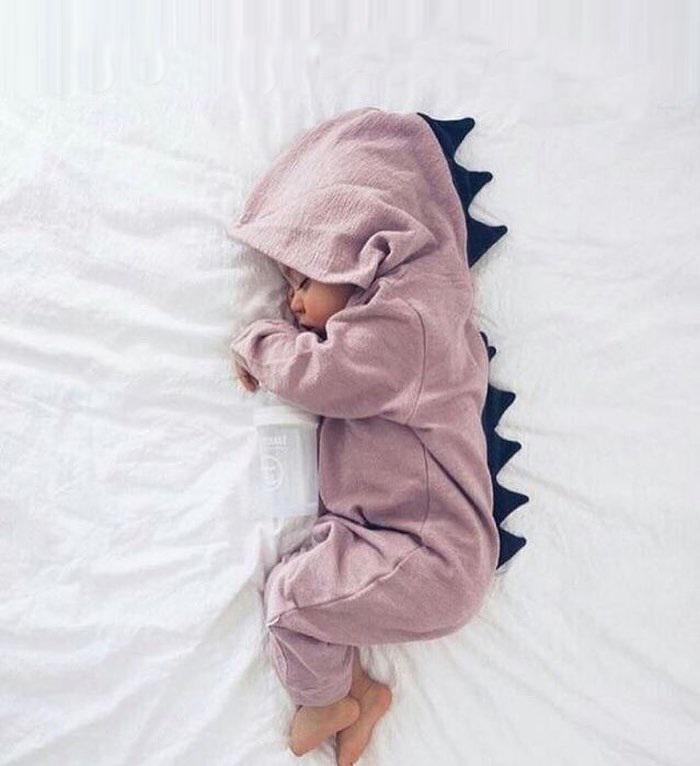 Adorable baby dinosaur romper with fun 3D spikes for infants & toddlers. Cute dino onesie outfit.