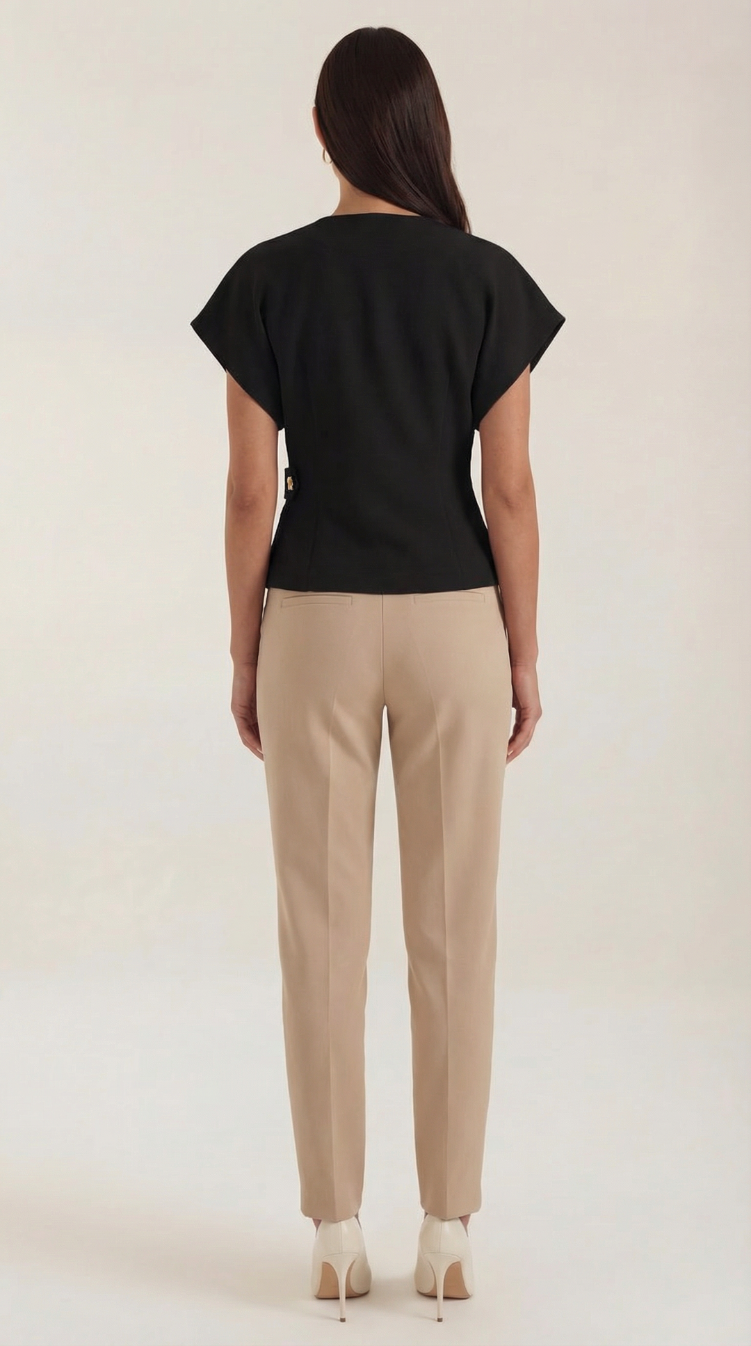 A flat lay of the Amy V-Neck Blouse, emphasizing its v-neck and wrap front for chic style.