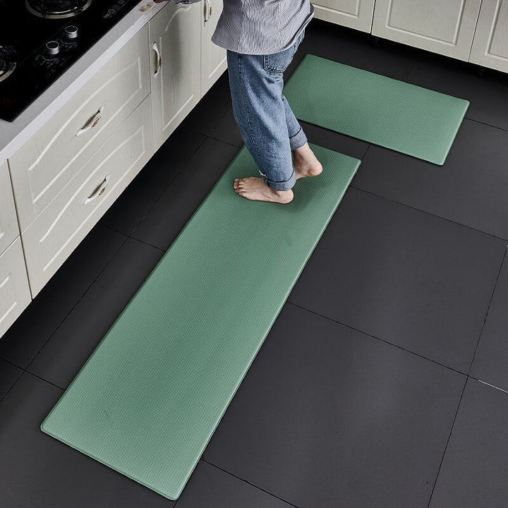 Waterproof kitchen mat repelling liquids. Anti-slip PVC rug providing cushioned anti-fatigue comfort and protection.