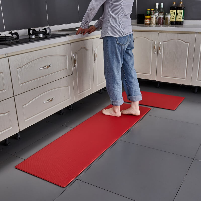 Anti-slip kitchen rug near sink. Waterproof comfort mat providing cushioned anti-fatigue support & floor protection.