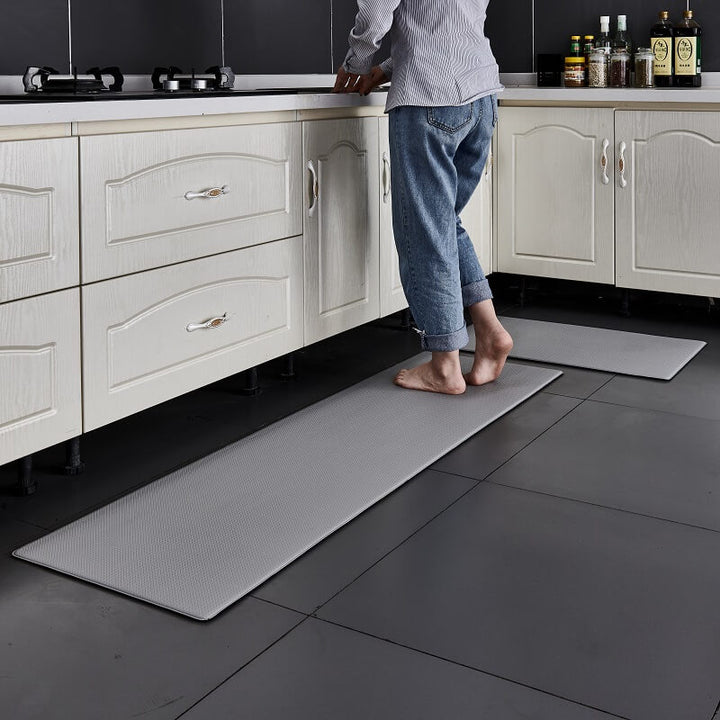 Rolled anti-fatigue kitchen rug. Waterproof PVC mat with cushioned comfort for easy storage and convenient transport.