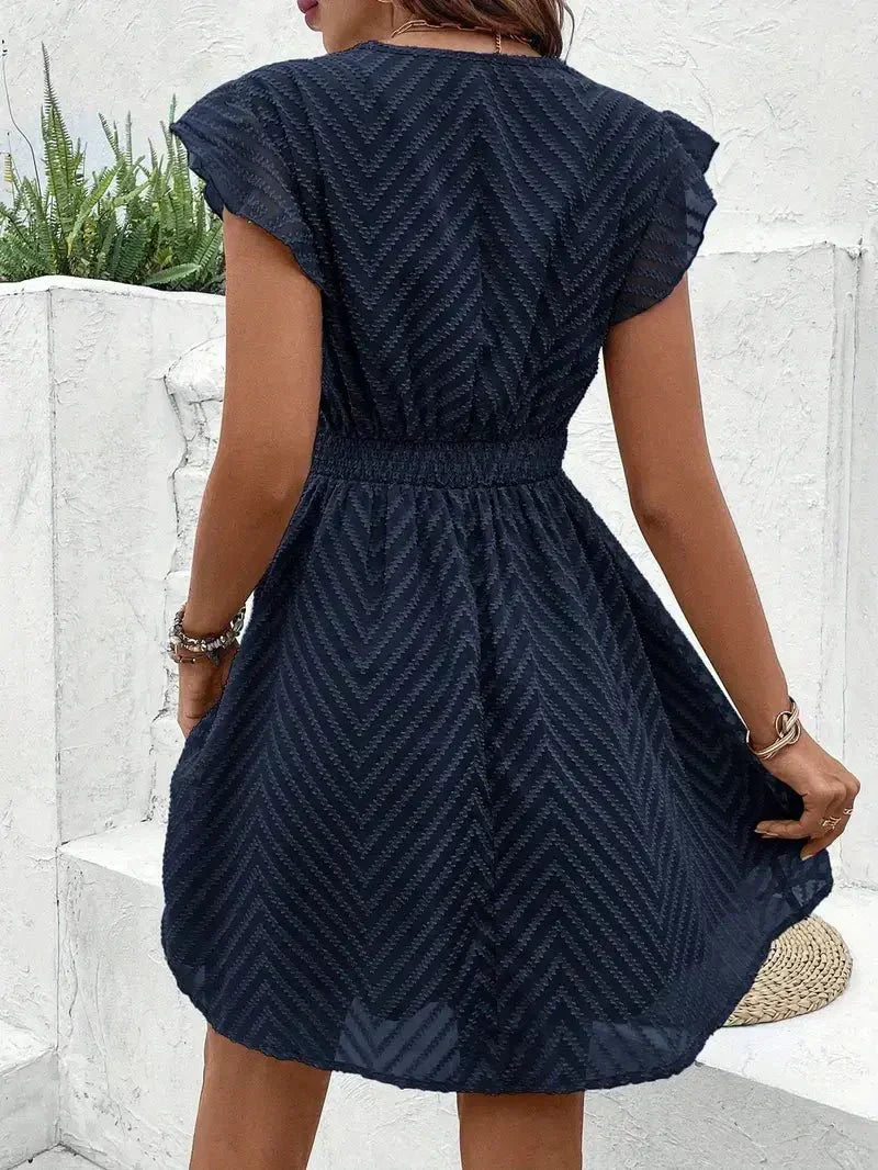 Elegant blue flutter sleeve V-neck mini dress. Flared & textured, ideal for women's parties & chic summer events.
