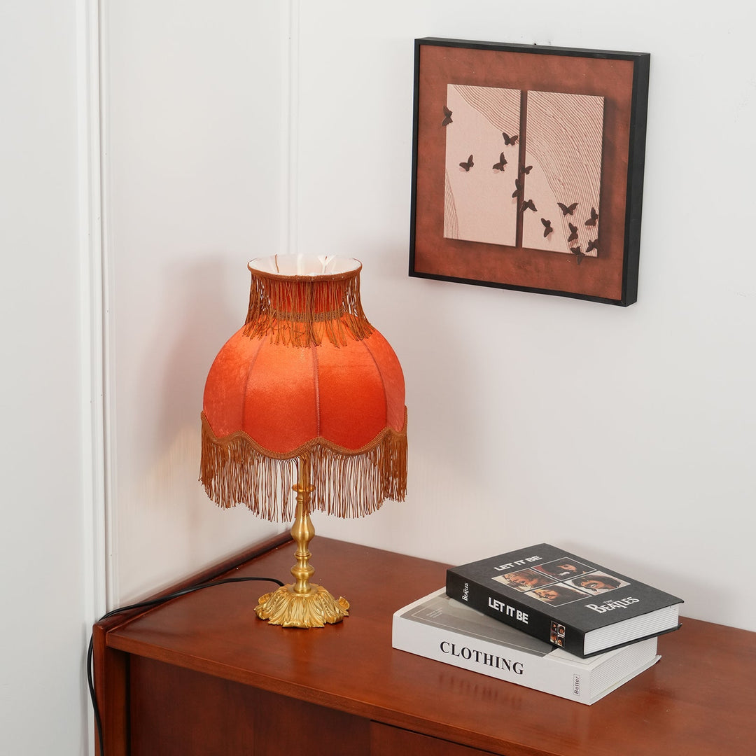 Chic red table lamp with a brass stand, Arina brand, for modern home ambiance.