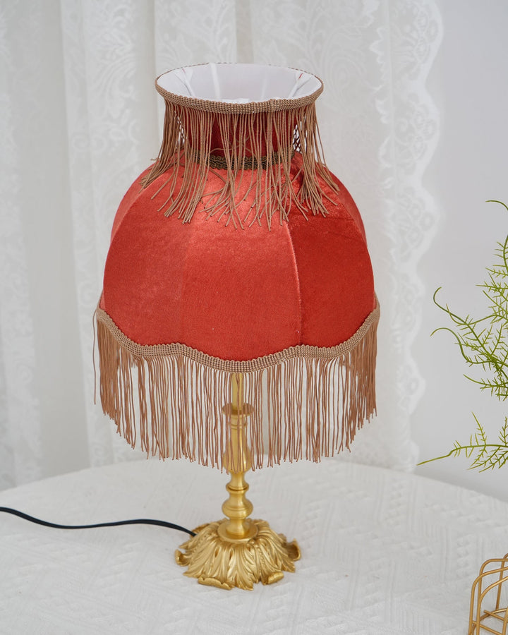 Red and brass table lamp, Arina design, for eclectic or classic home aesthetics.