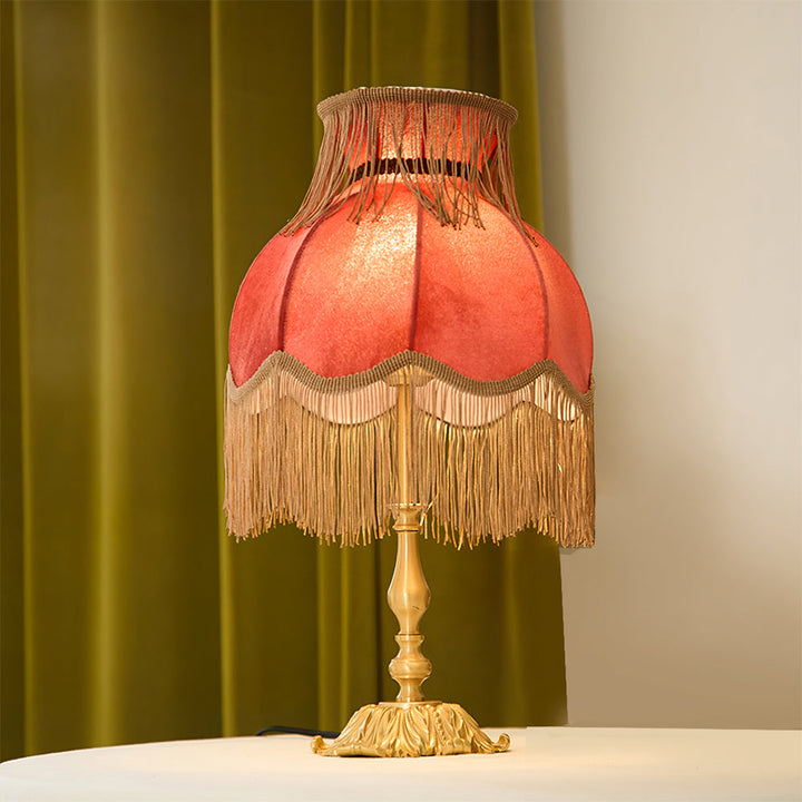 Decorative Arina red and brass table lamp, unique statement piece for modern homes.