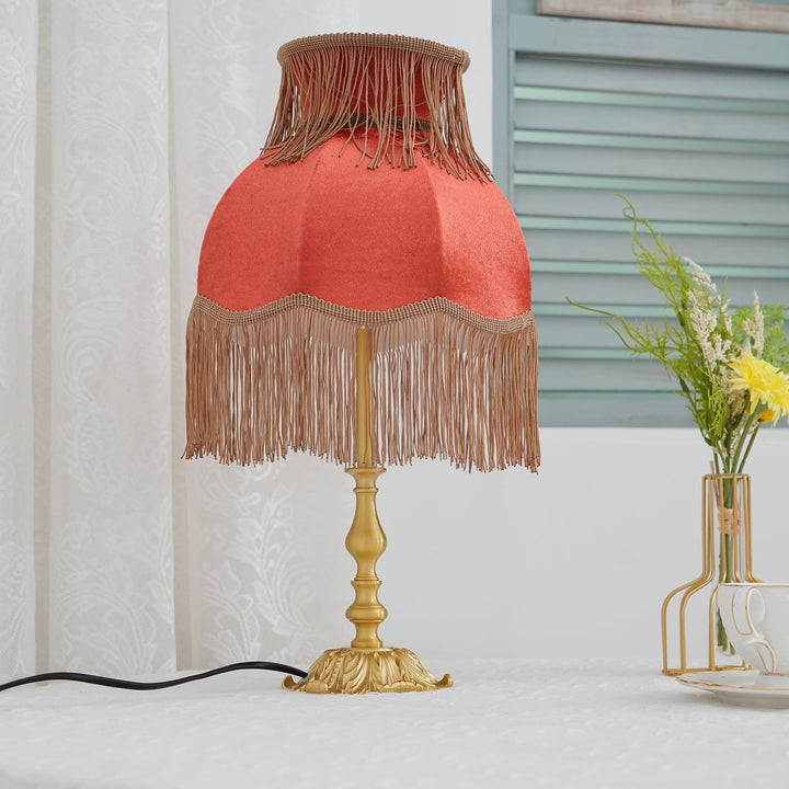 Arina Red and Brass table lamp, a versatile accent light for various interior styles.