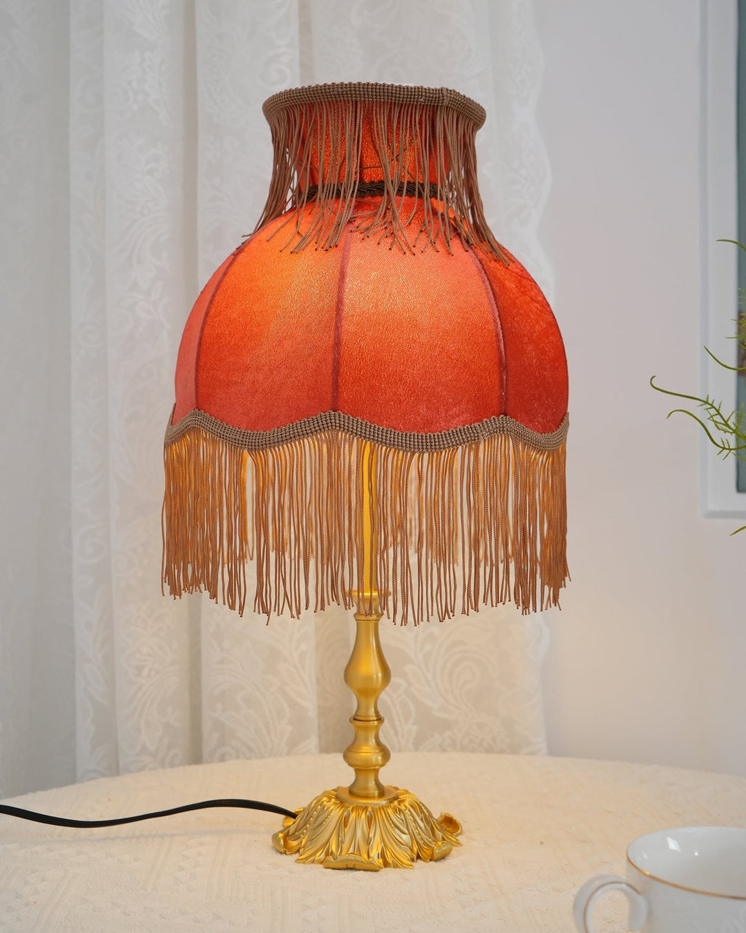 Bold Arina red table lamp with sophisticated brass base, modern home decor item.