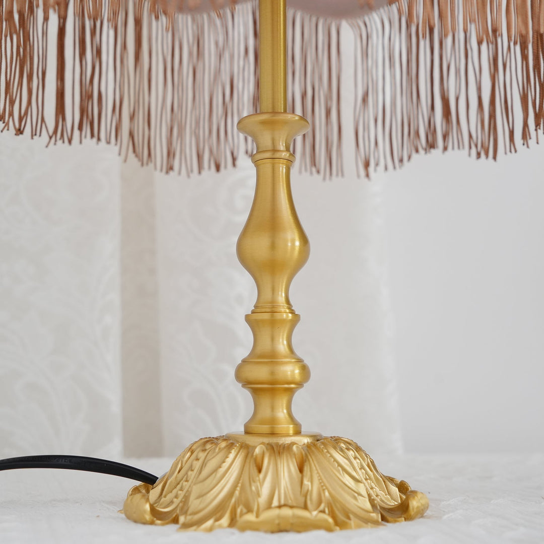 Arina decorative lamp: vibrant red shade, elegant brass stand, perfect accent lighting.