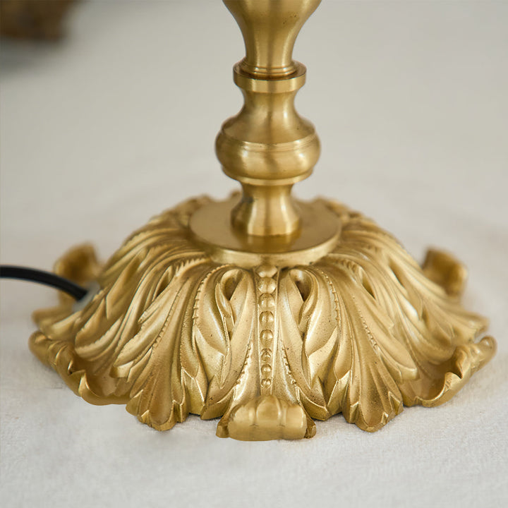Modern bohemian Arina red lamp with brass details, stylish decorative lighting fixture.
