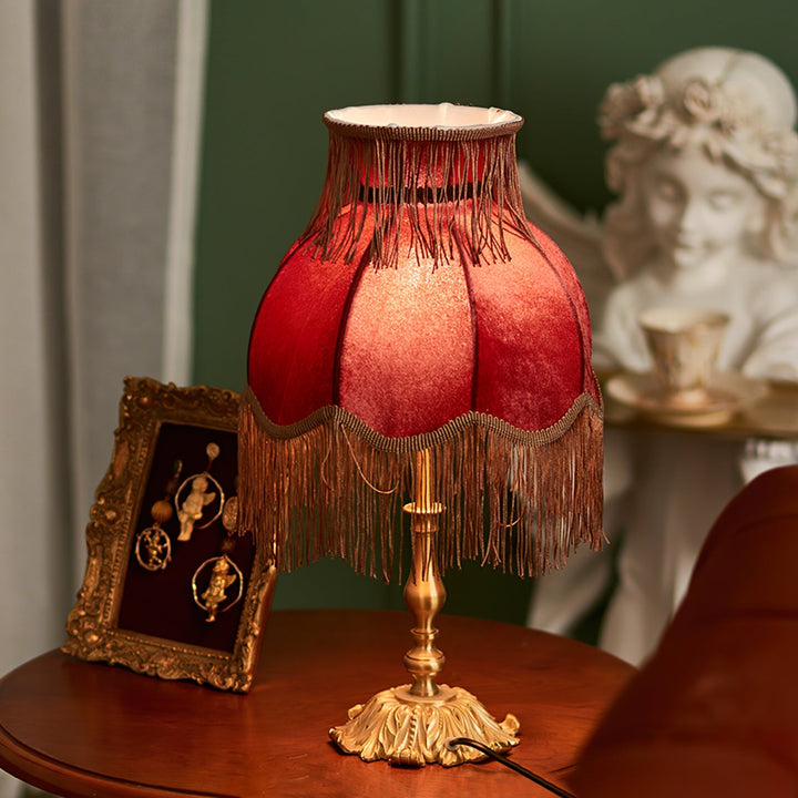 Bohemian red and brass table lamp by Arina, adds a classic touch to any room.