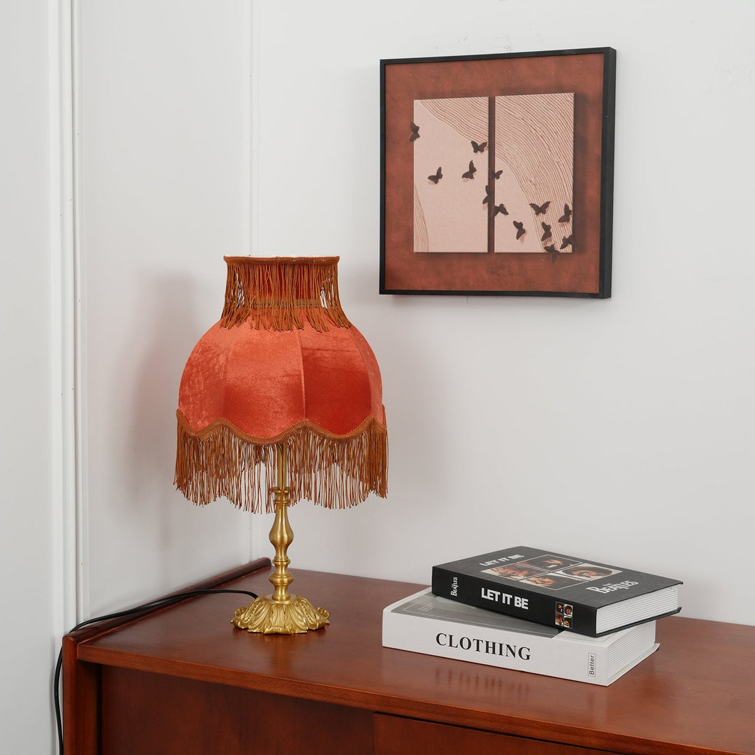 Elegant Arina red table lamp with stunning brass finish, unique home decor item.