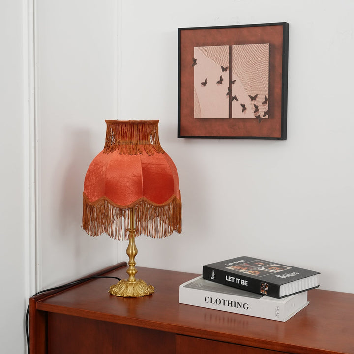 Elegant Arina red table lamp with stunning brass finish, unique home decor item.