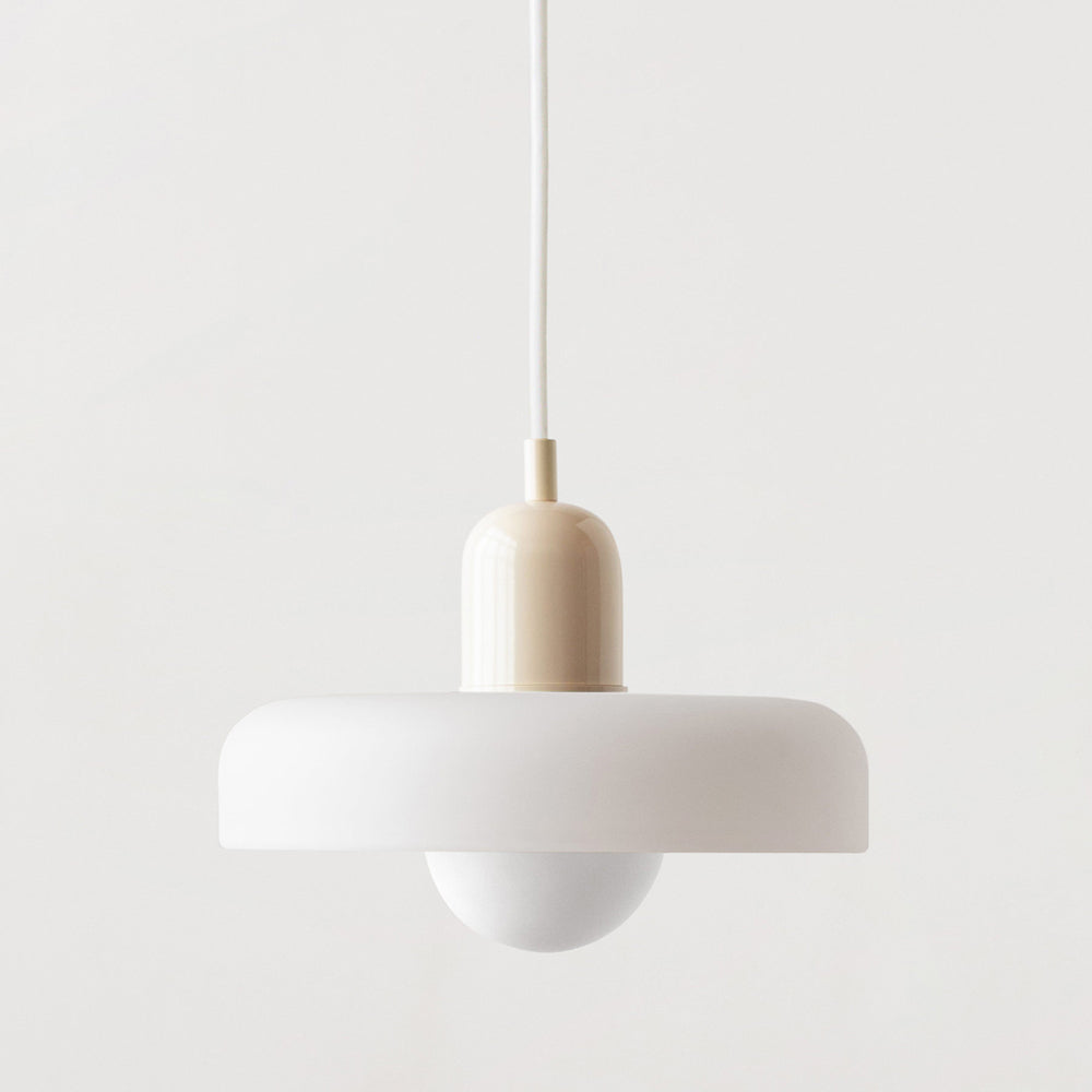 Living room decor featuring a striking Bauhaus colored glass pendant.
