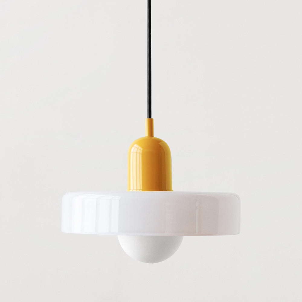 Dining room ambiance enhanced by a modern Bauhaus pendant light.