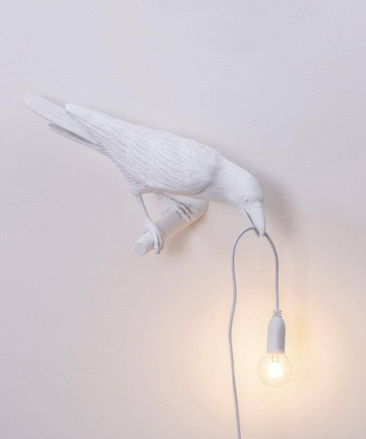 Artistic crow table lamp with a unique bird design. Modern decorative lighting, a distinctive home accent piece.