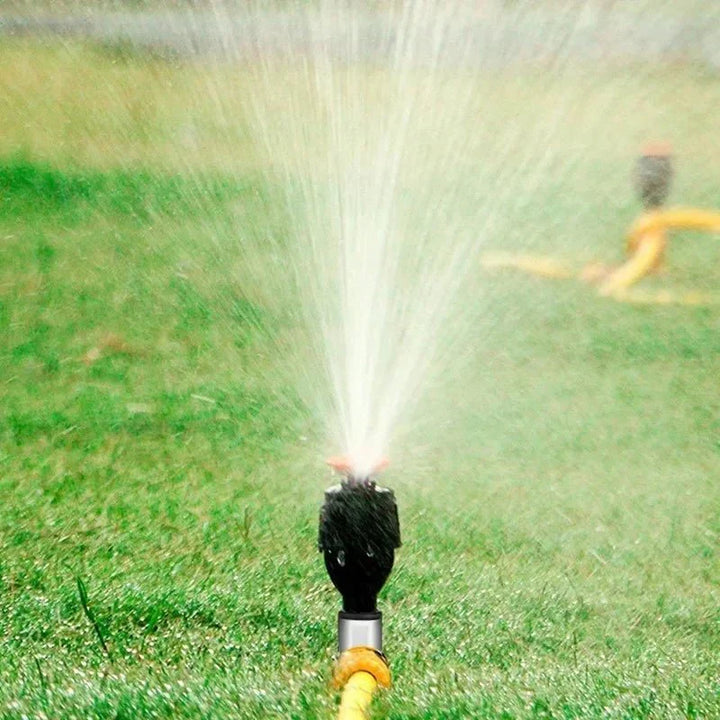 Garden sprinkler in action, providing consistent plant care and lawn hydration.