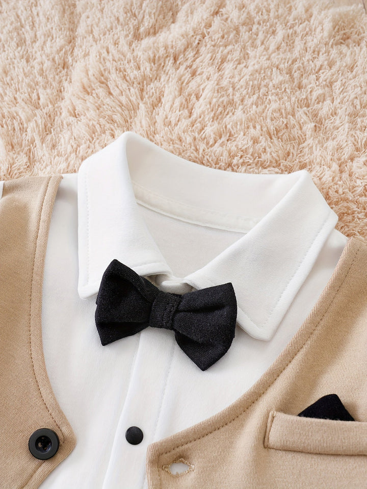 Newborn outfit: adorable gentleman romper with a chic black bow tie.