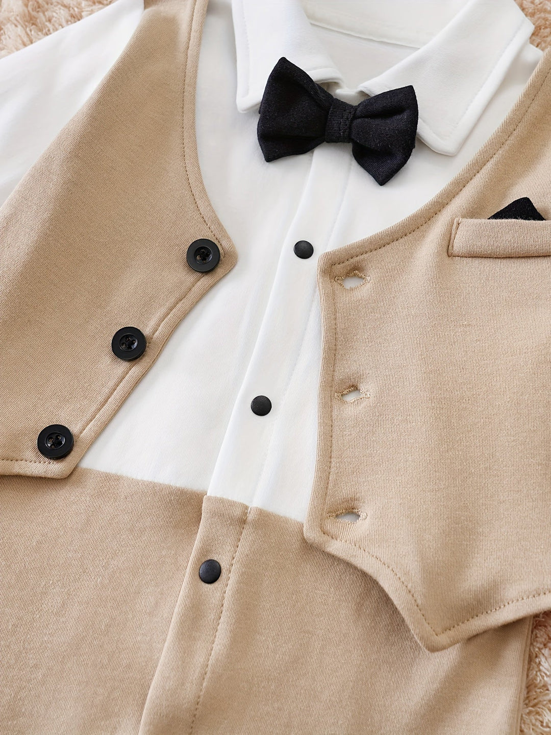 Comfortable and stylish baby boy clothes, this romper has a festive bow tie.