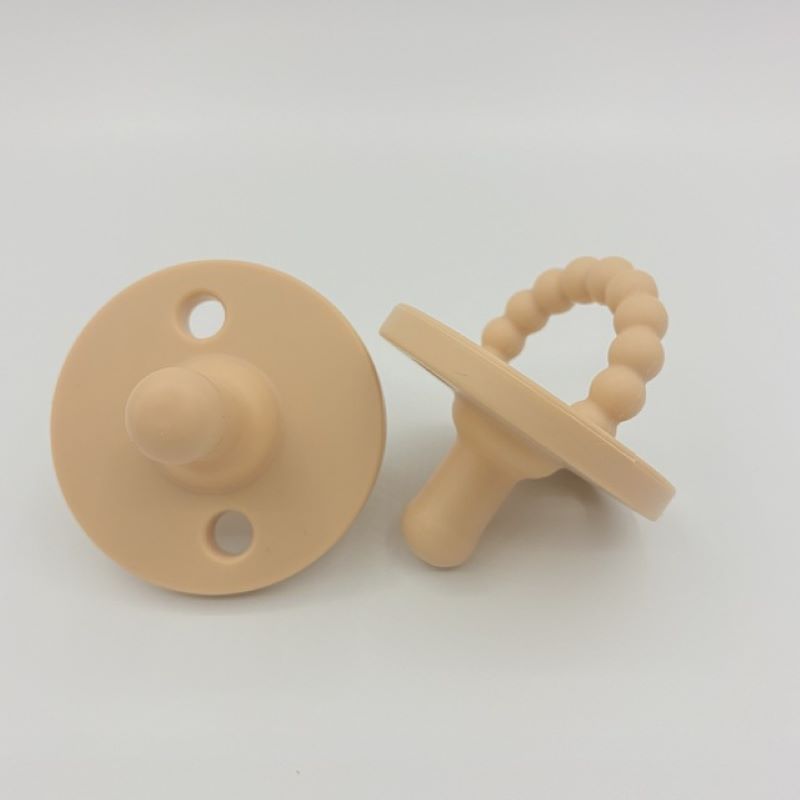 Multipurpose baby pacifier and teether for teething and soothing needs.