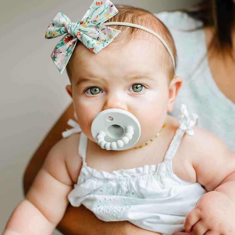 Close-up of a soft silicone baby teether offering gum relief for teething babies.