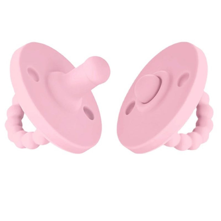 Teething relief pacifier with a textured surface to massage sore infant gums.