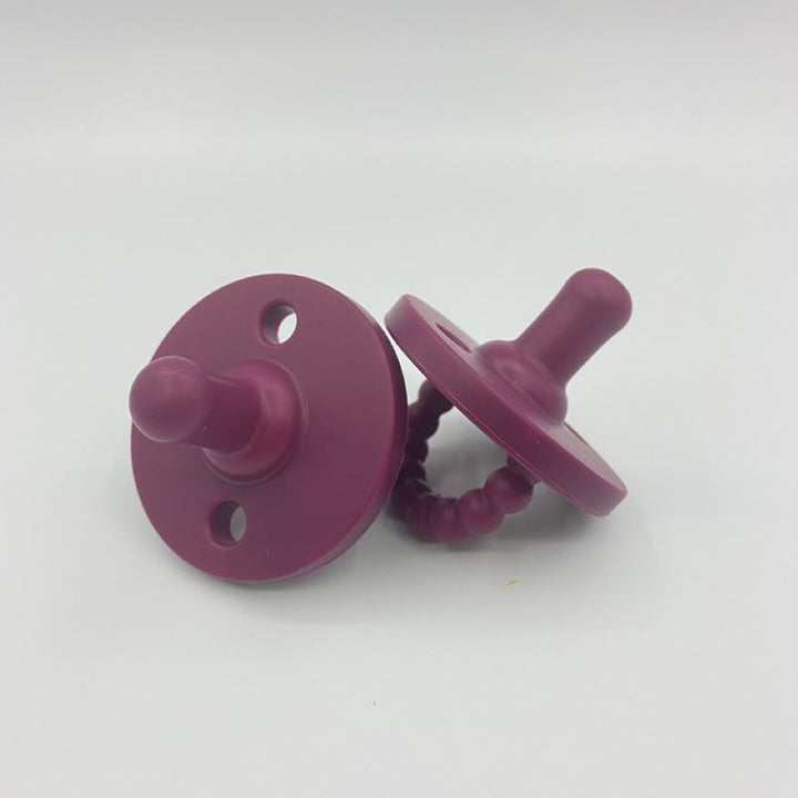 Safe and durable medical-grade silicone pacifier for babies aged 0-24 months.