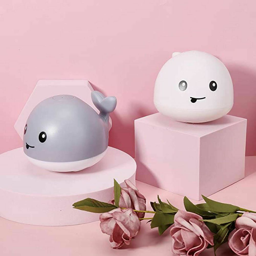 Cute whale LED bath toy that sprays water, an engaging educational toy for infants.