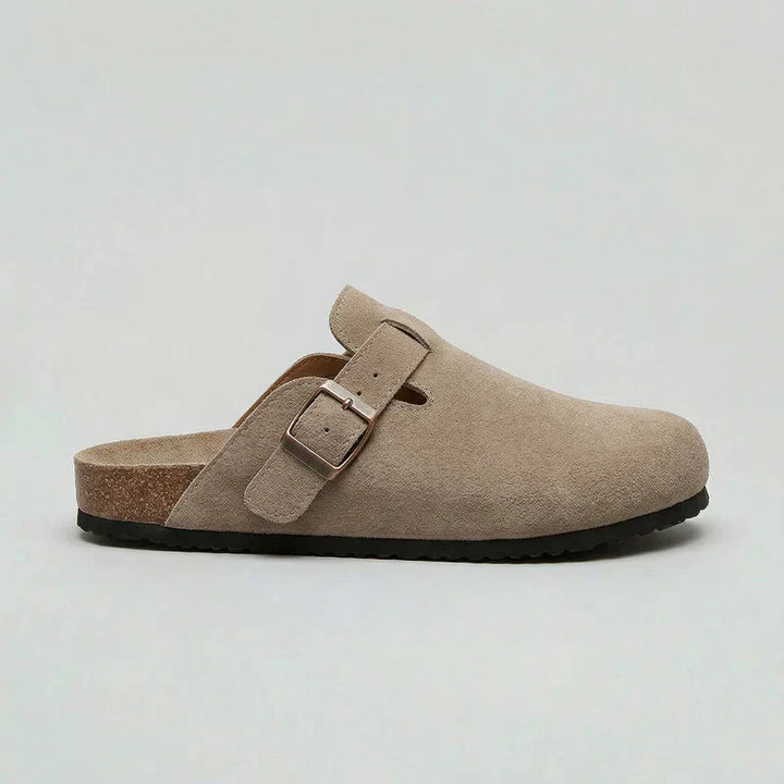 Beige unisex comfort clogs with an adjustable buckle, perfect for easy slip-on casual wear and everyday support.