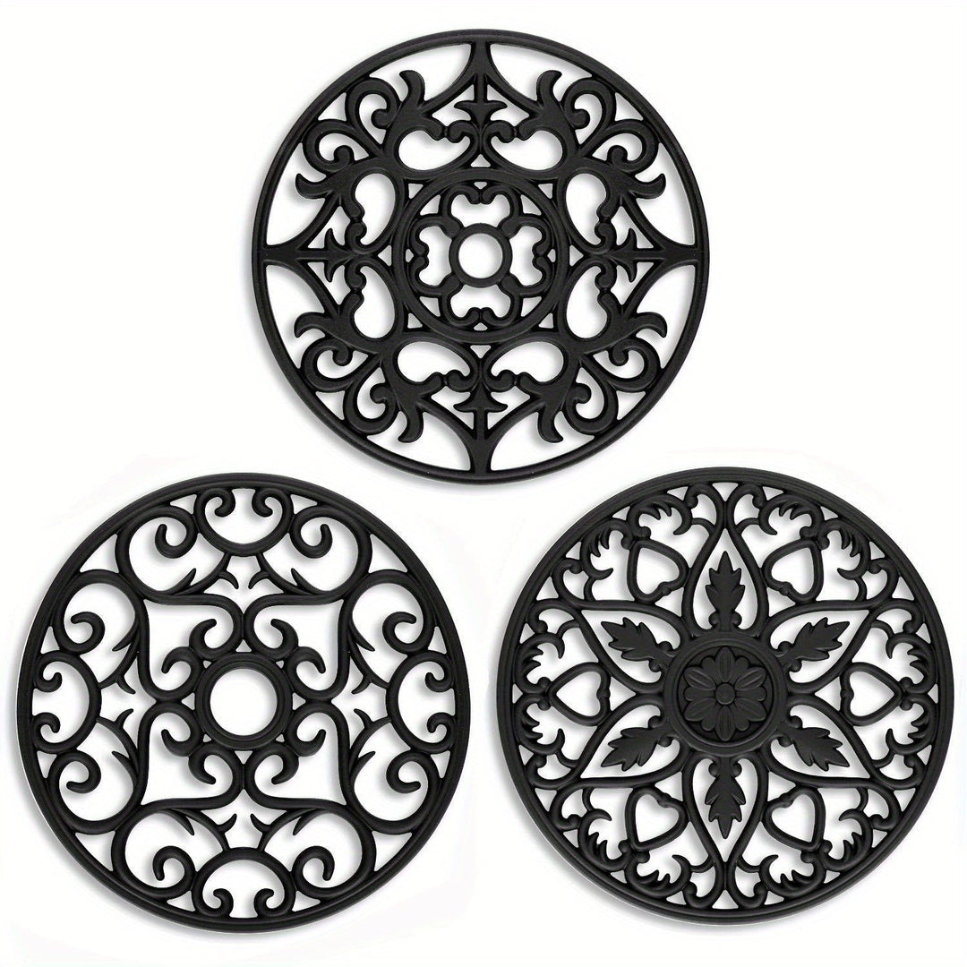 Black heat-resistant silicone trivet set for kitchen and dining. Protects countertops & tables from hot pots, non-slip.