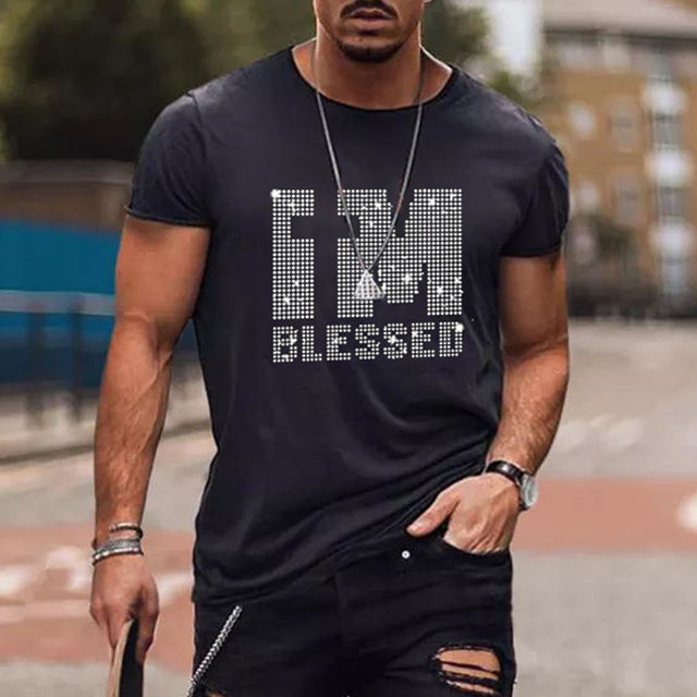 Fashionable men's black graphic tee, embellished with a sparkling rhinestone crown logo, streetwear ready.