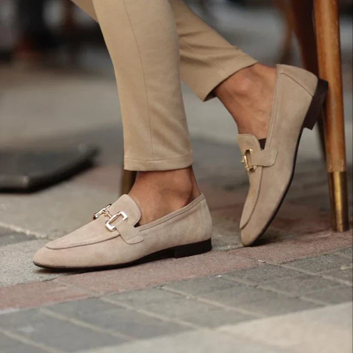 Beige leather men's slip-on loafers with elegant horsebit detail. Perfect comfortable footwear for daily wear.