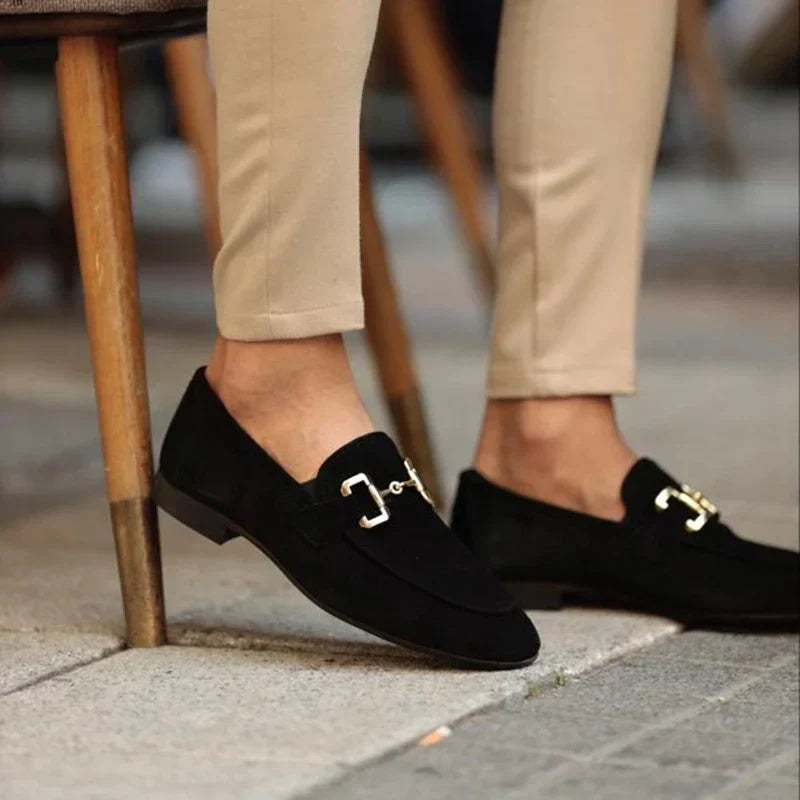 Men's black horsebit slip-on loafers, displaying a durable sole for versatile wear & comfortable support.