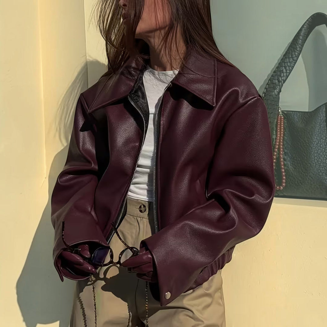 Black women's casual moto jacket with lapel collar, perfect for stylish everyday wear.