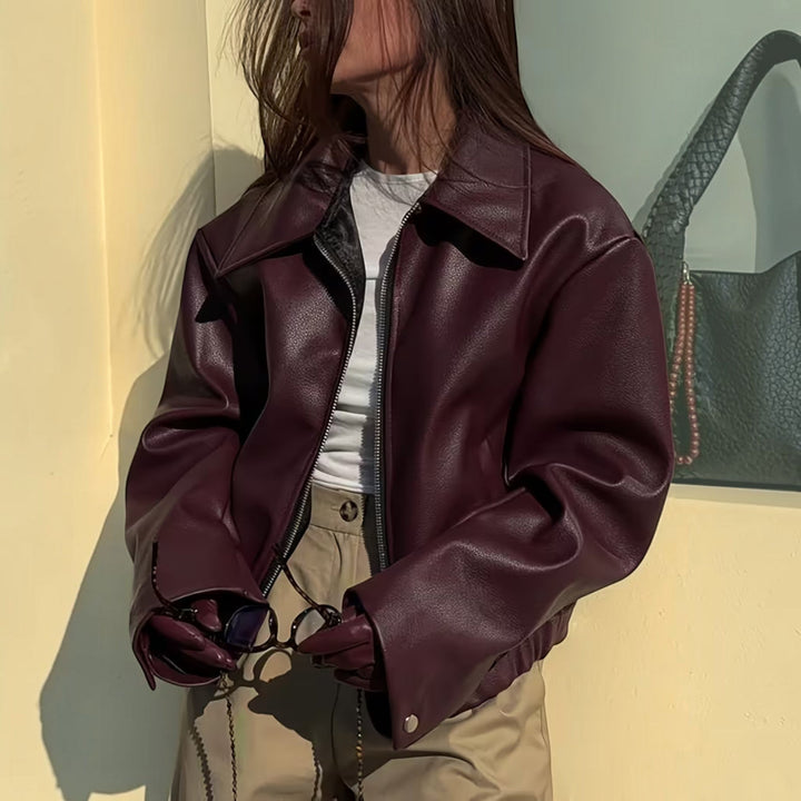 Black women's casual moto jacket with lapel collar, perfect for stylish everyday wear.