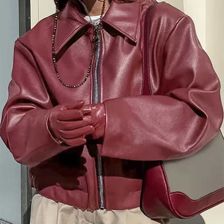 Black women's moto jacket, a casual outerwear piece with a sophisticated lapel collar.