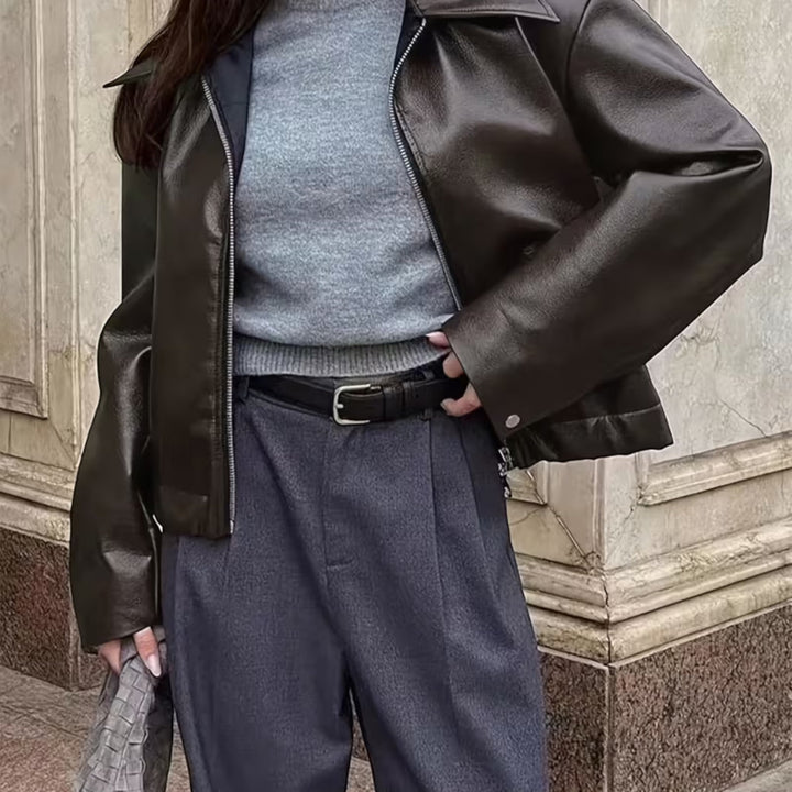 Edgy women's moto jacket, sleek lapel collar design for a modern, casual fashion statement.