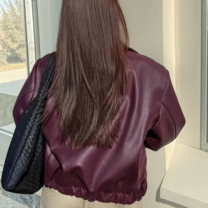 Elegant women's moto jacket, classic design with a chic lapel collar for sophisticated style.
