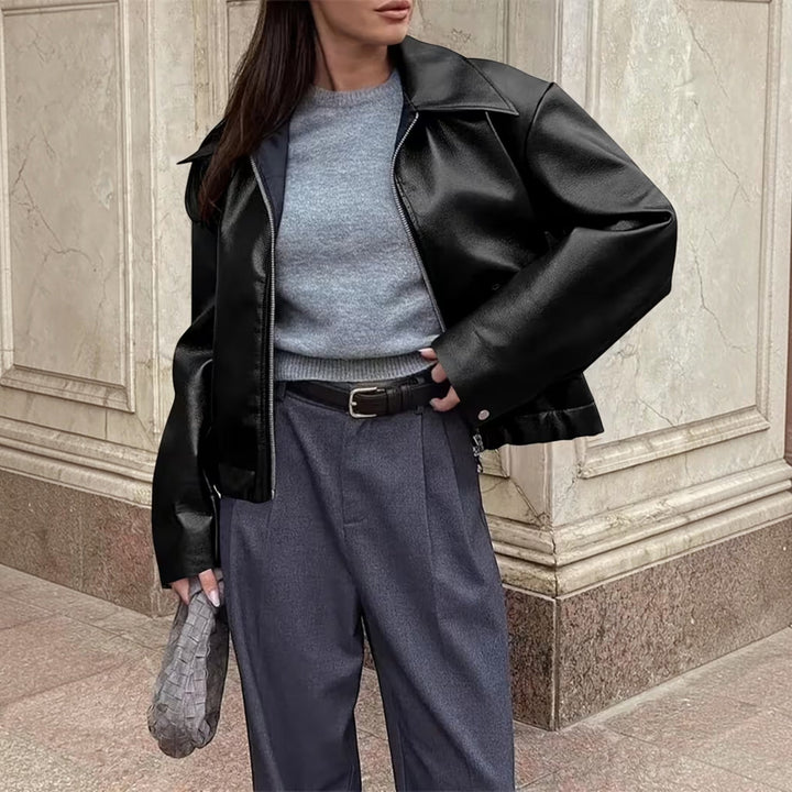 Stylish women's faux leather moto jacket, featuring a trendy lapel collar for casual outfits.