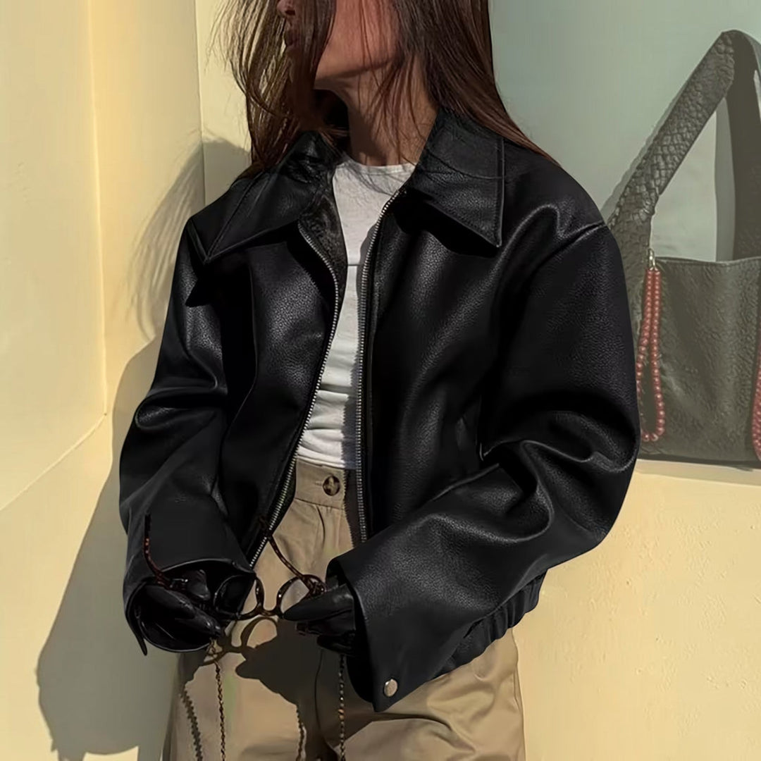 Trendy women's moto jacket with a distinctive lapel collar, enhancing any casual ensemble.