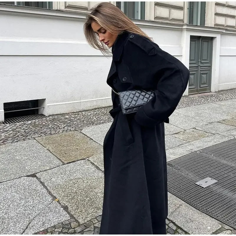 Elegant women's double-breasted trench coat, belted for a tailored look. Perfect classic outerwear.