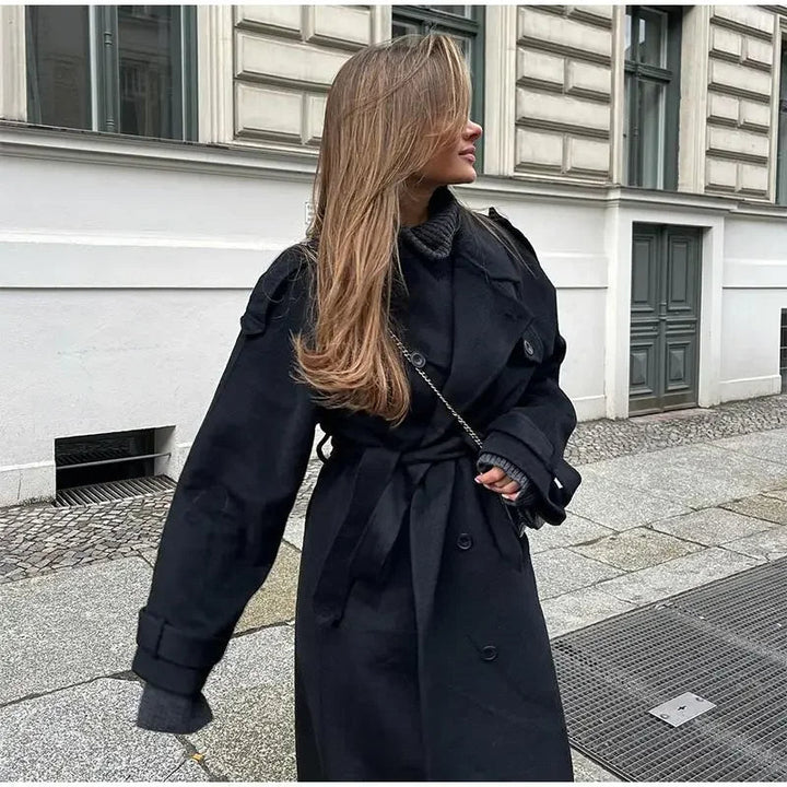 Chic black women's trench coat, double-breasted design with adjustable belt. Essential fall fashion.