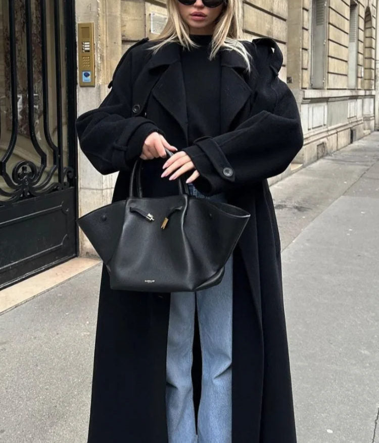 Versatile women's belted trench coat, double-breasted and classic. An essential piece of women's outerwear.