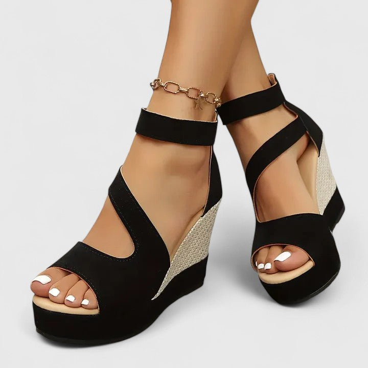 Summer-ready black wedge sandals for women, providing comfortable and stylish footwear.