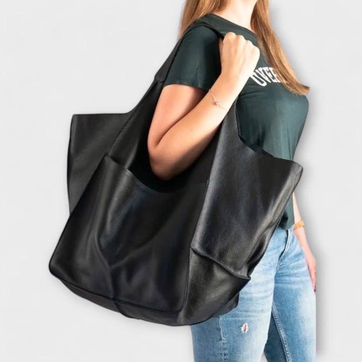 Green versatile women's tote bag, faux leather, spacious and durable for daily wear.
